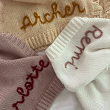 Hand-embroidered baby blanket in blush
