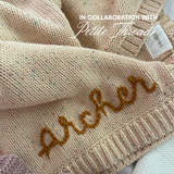 Hand-embroidered baby blanket in sand